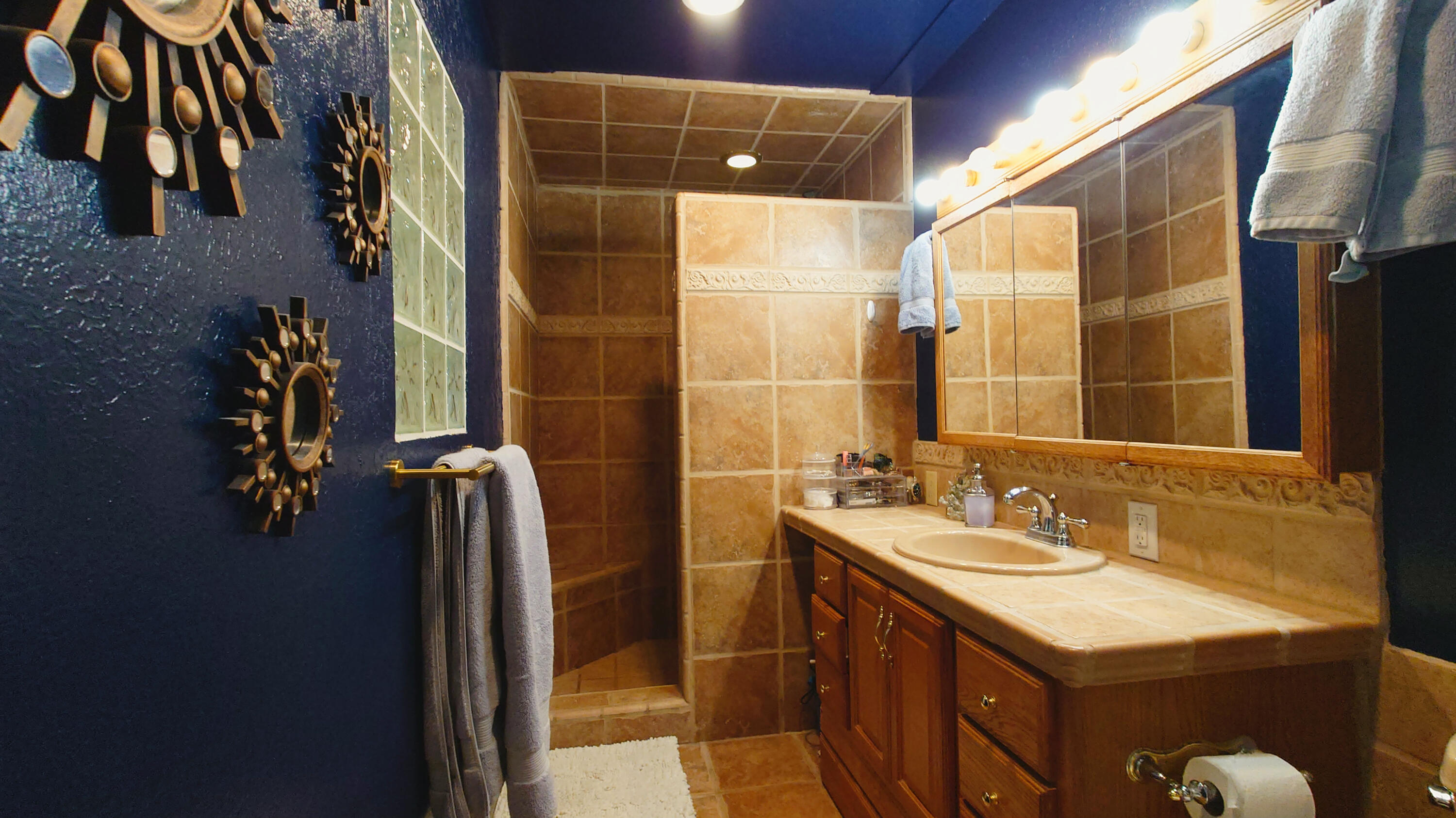 1713 Cascade Lane Redding, CA 96002 - Photo 6 of 12 a bathroom with a sink vanity and a mirror