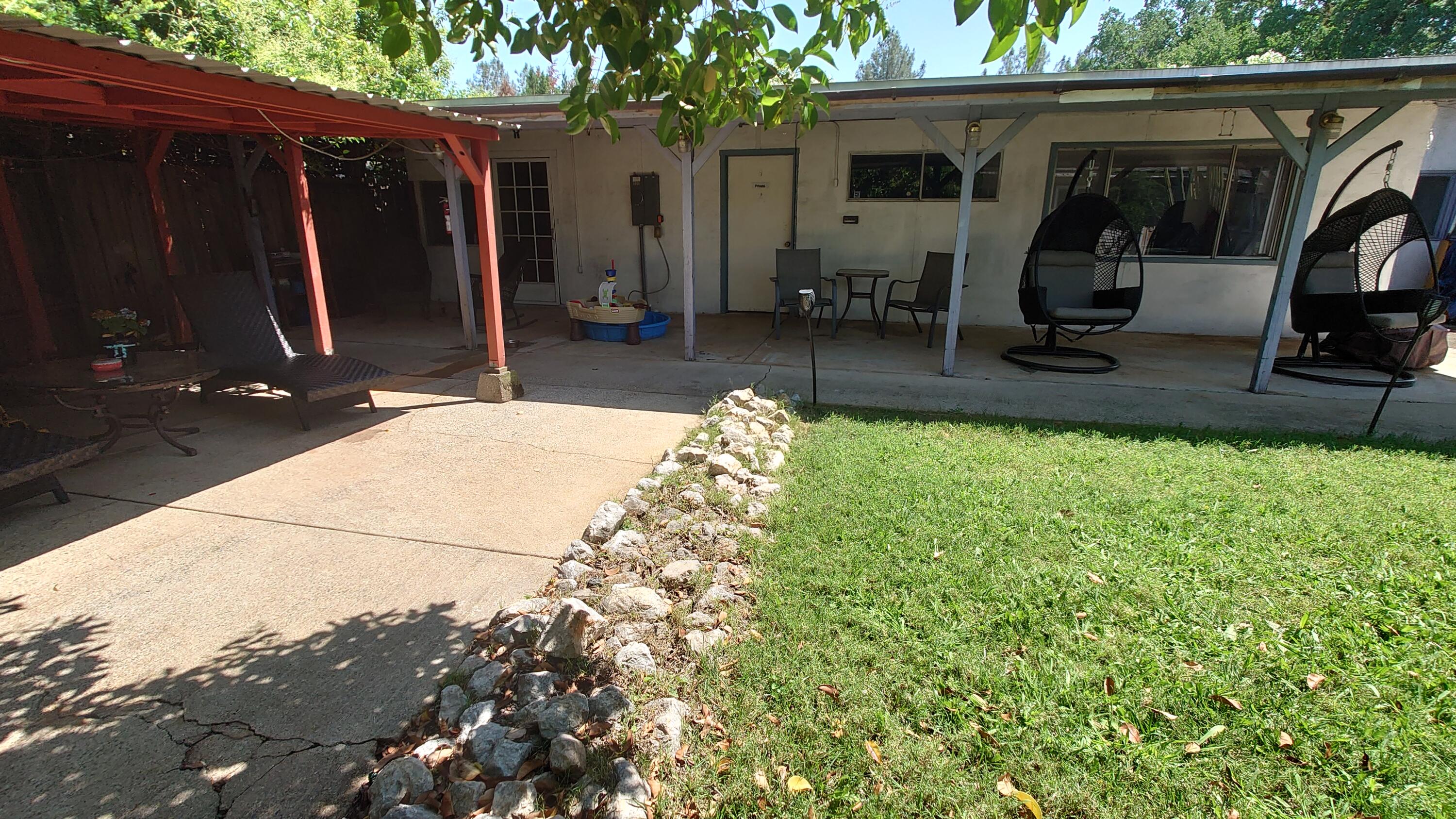 1713 Cascade Lane Redding, CA 96002 - Photo 10 of 12 a view of a house with backyard and sitting area