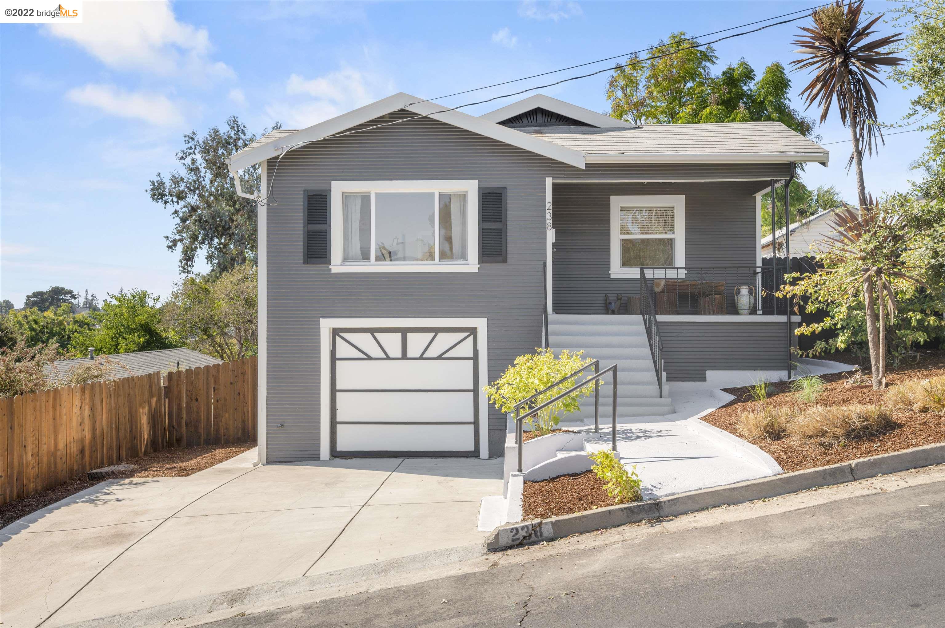 238 Napa Avenue Rodeo, CA 94572 - Photo 1 of 1 a front view of a house with a garden