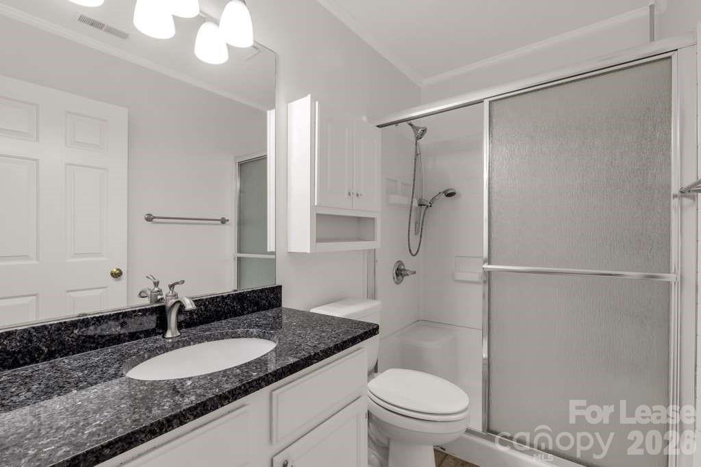 402 Sweetgum Drive Fort Mill, SC 29715 - Photo 5 of 10 a bathroom with a granite countertop sink toilet and shower