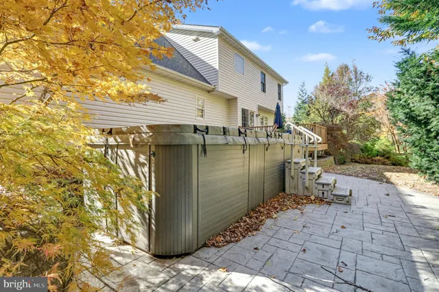 a view of a patio with table and chairs and potted plants