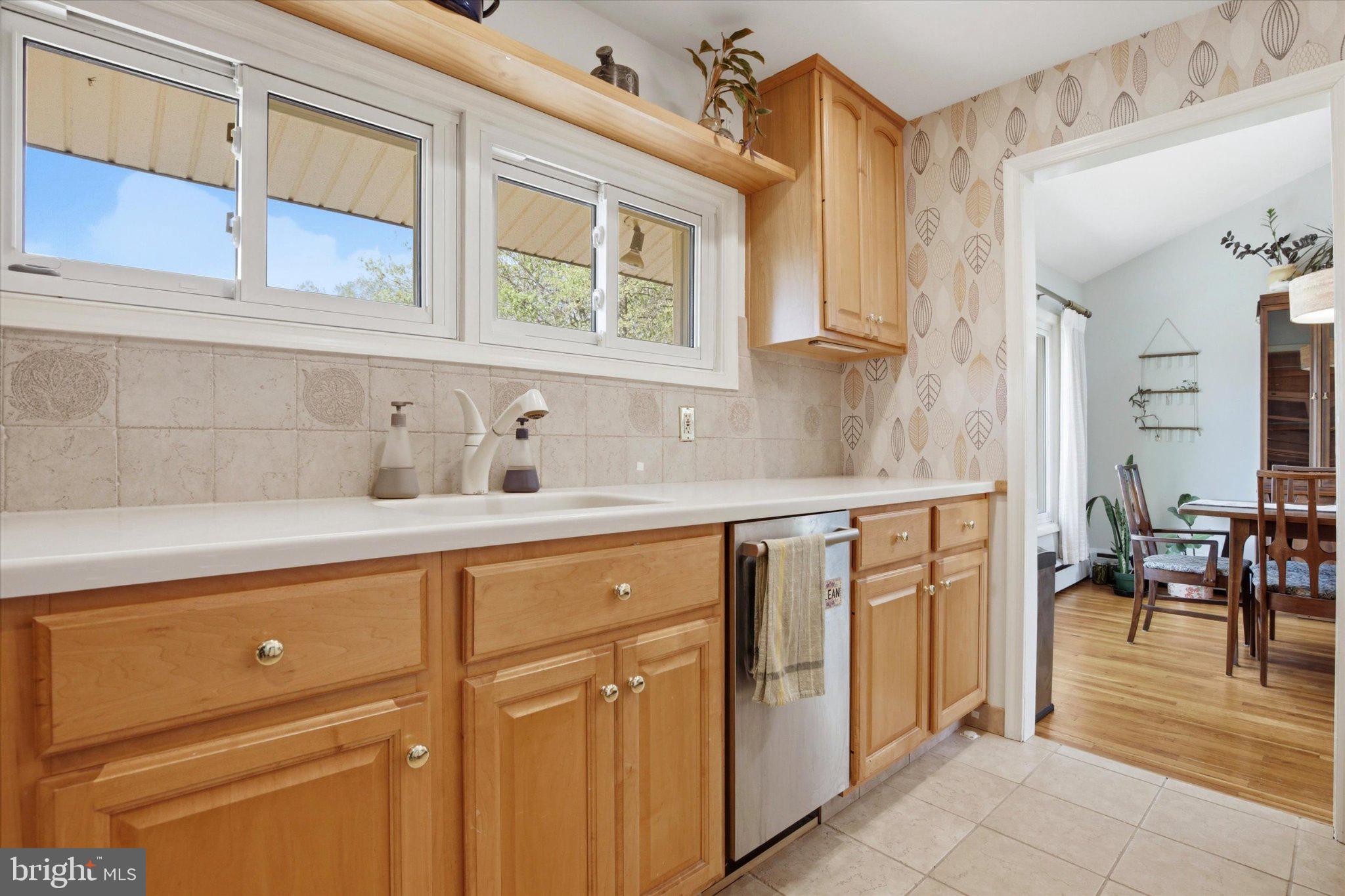 3386 Bristol Road Chalfont, PA 18914 - Photo 12 of 35 a kitchen with stainless steel appliances granite countertop a sink a stove and cabinets