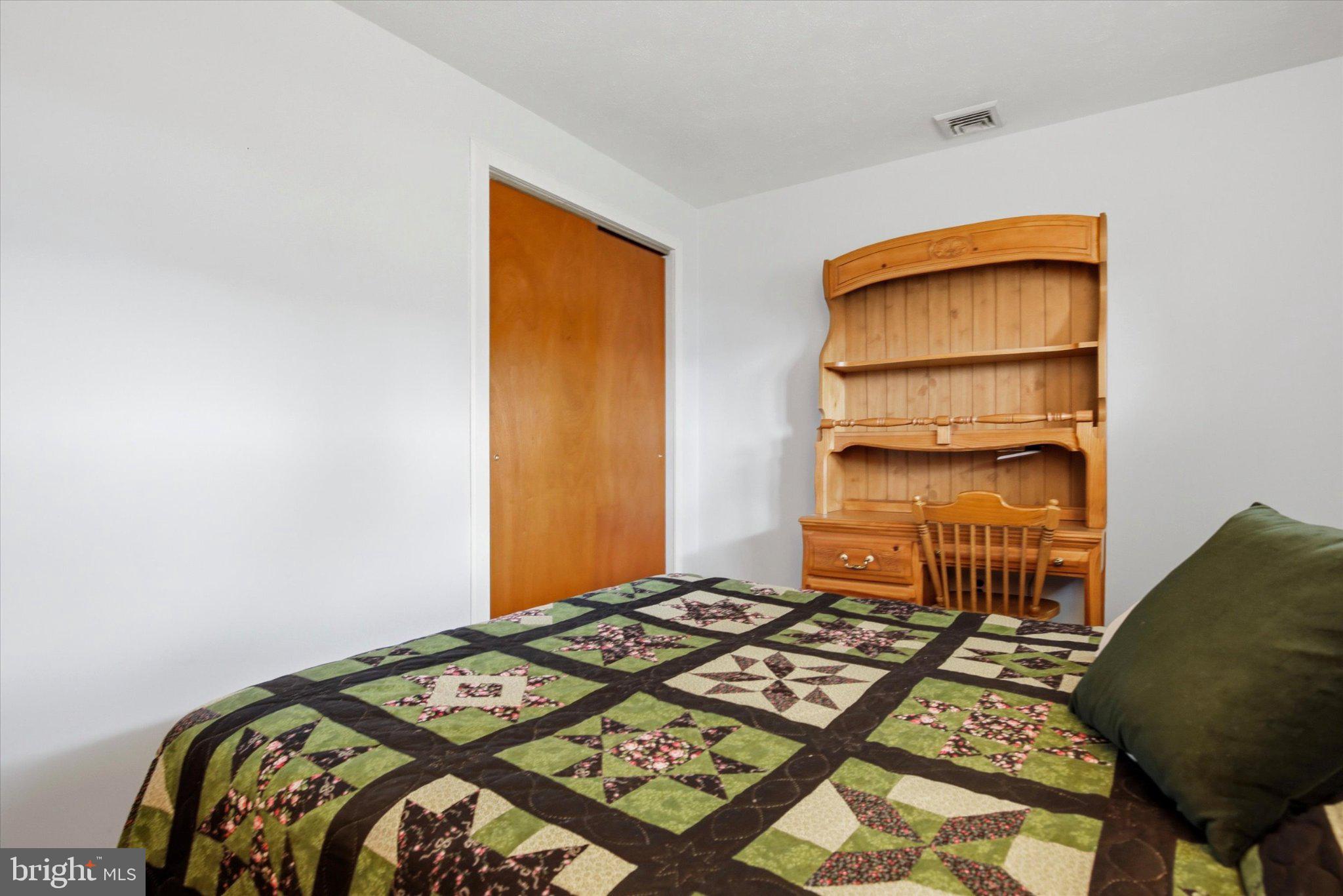 3386 Bristol Road Chalfont, PA 18914 - Photo 18 of 35 a bedroom with a bed and chair