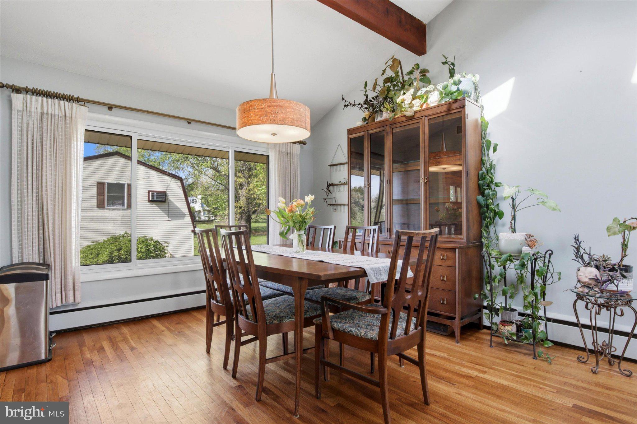 3386 Bristol Road Chalfont, PA 18914 - Photo 8 of 35 a dining room with furniture a chandelier and wooden floor