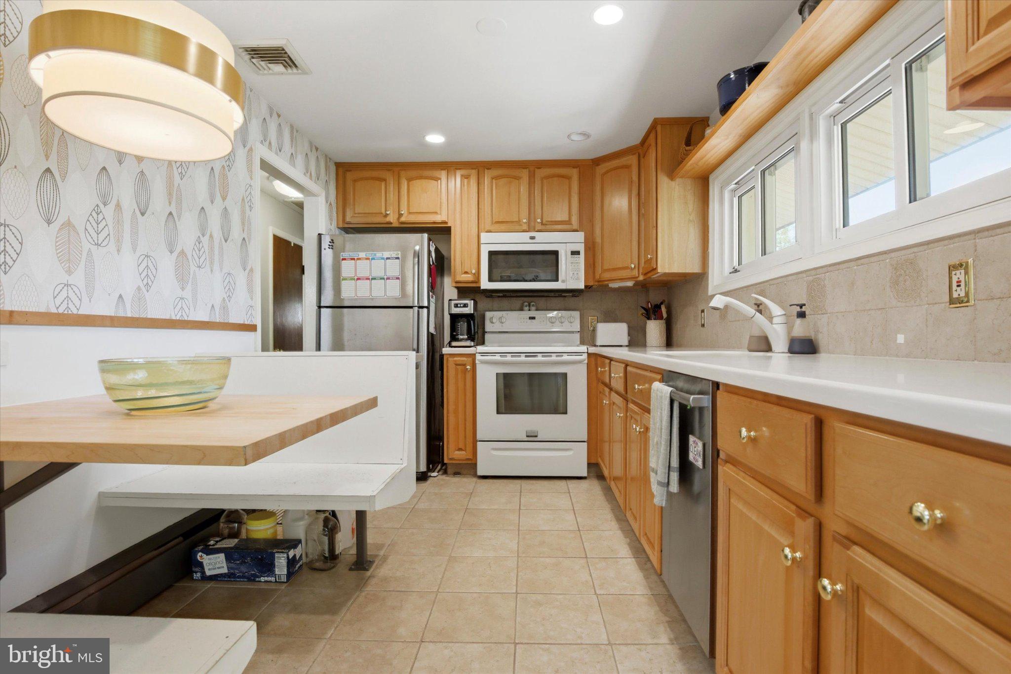 3386 Bristol Road Chalfont, PA 18914 - Photo 10 of 35 a kitchen with a sink a stove and cabinets