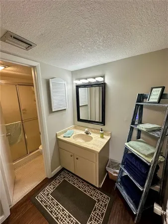 a room with a sink and a mirror
