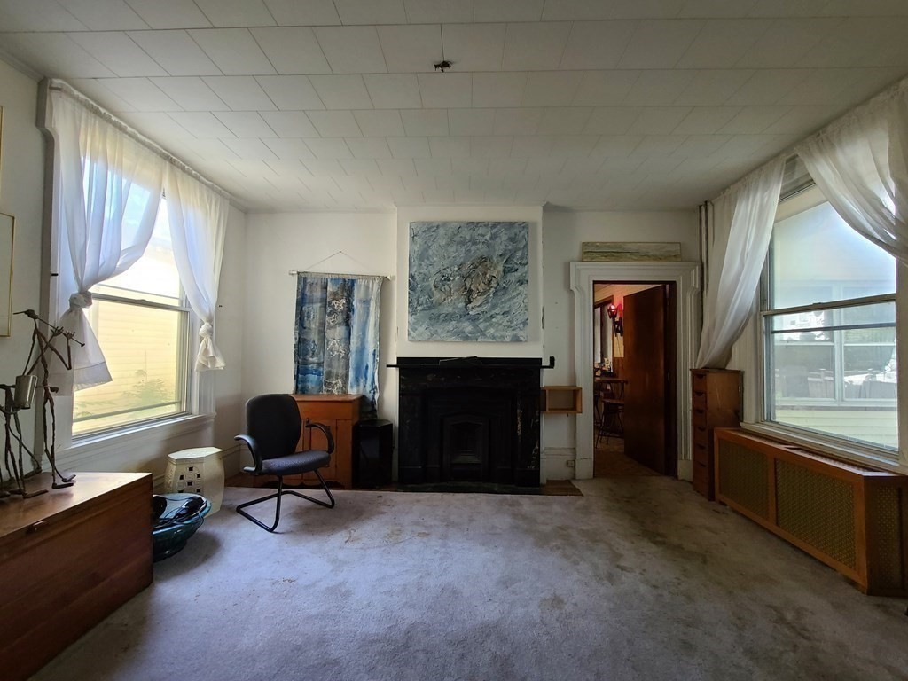 16 Malbert Road Boston, MA 02135 - Photo 12 of 38 a livingroom with workspace and a window