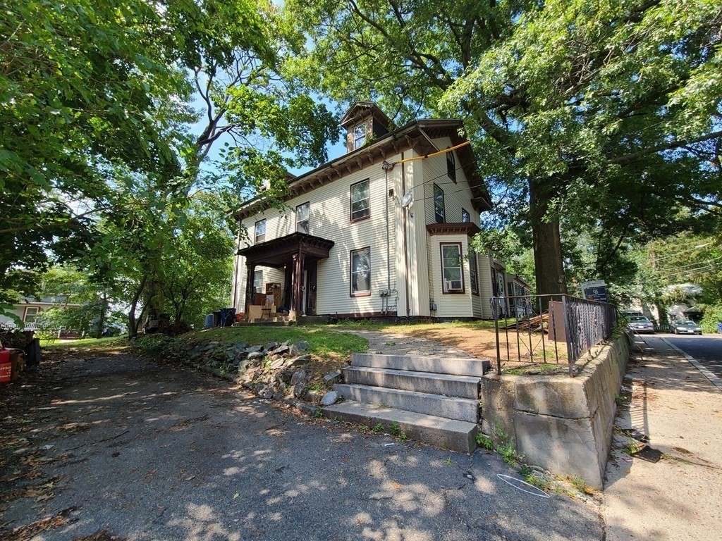 16 Malbert Road Boston, MA 02135 - Photo 2 of 38 a front view of a house with garden