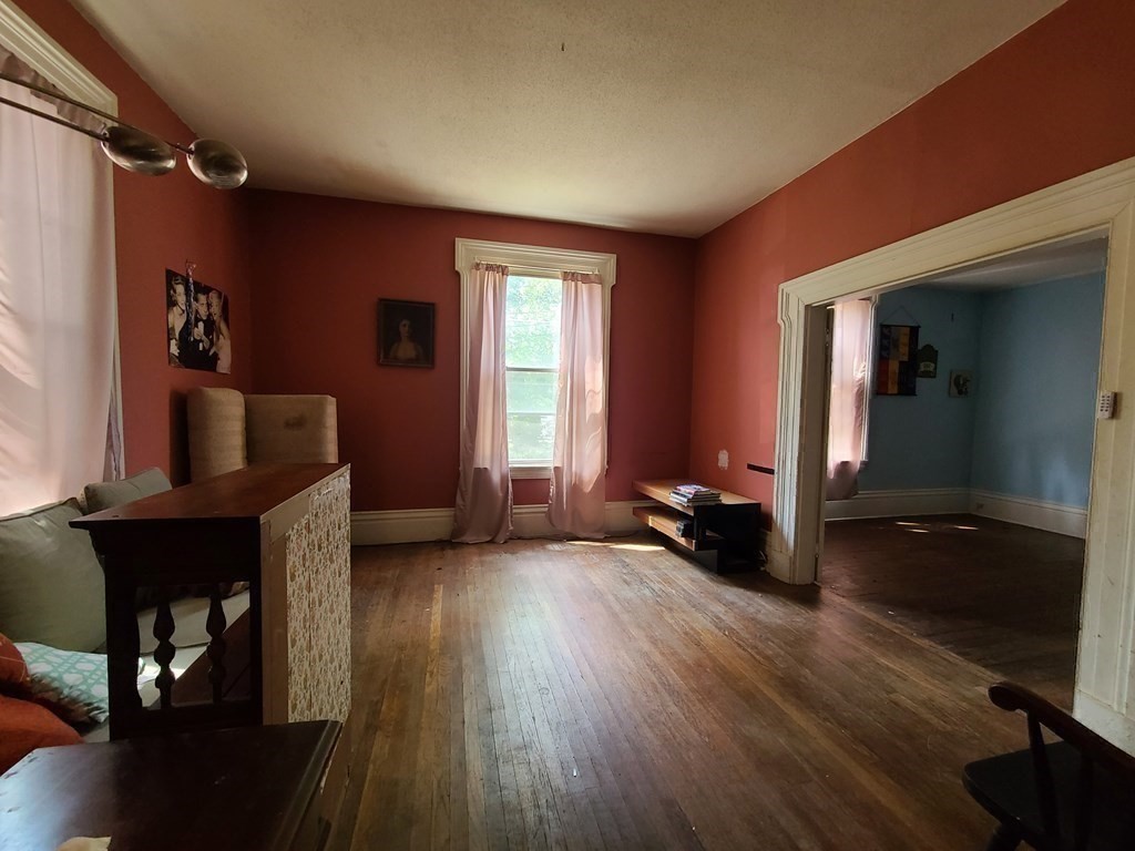 16 Malbert Road Boston, MA 02135 - Photo 21 of 38 a living room with furniture and a wooden floor