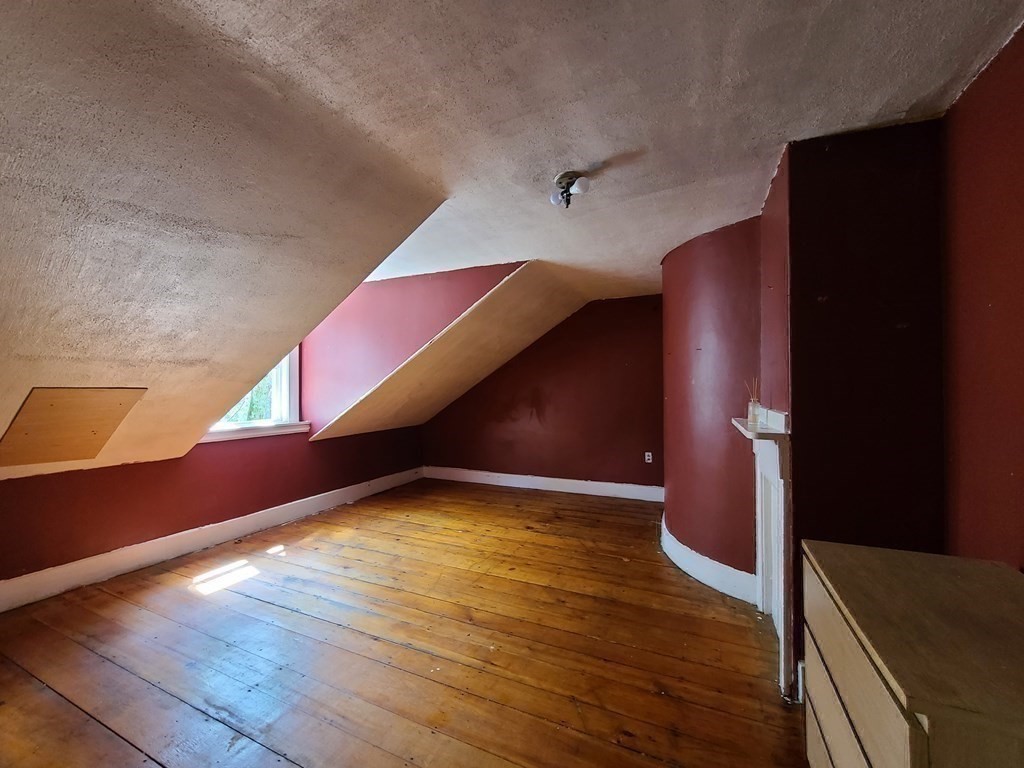 16 Malbert Road Boston, MA 02135 - Photo 24 of 38 a view of an empty room with wooden floor