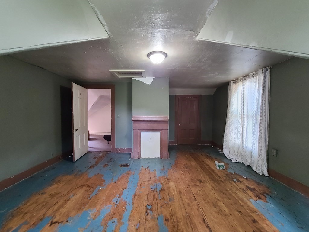 16 Malbert Road Boston, MA 02135 - Photo 25 of 38 an empty room with wooden floor and windows