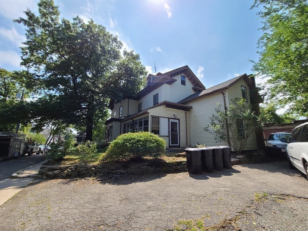 16 Malbert Road Boston, MA 02135 - Photo 30 of 38 a view of a house with a backyard and a tree