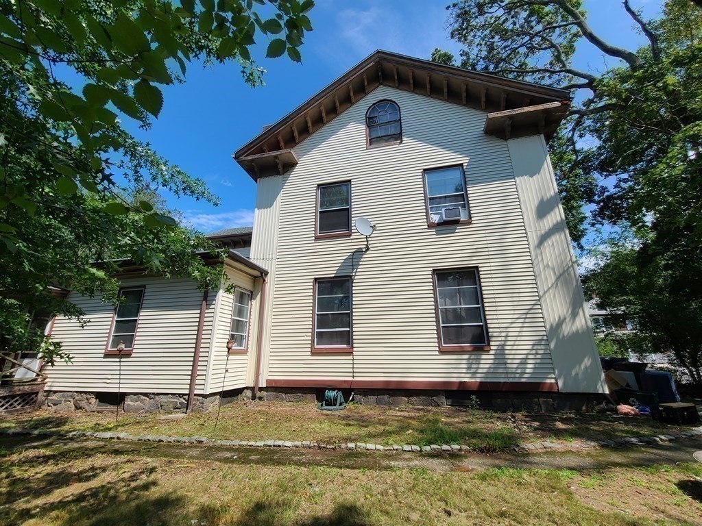 16 Malbert Road Boston, MA 02135 - Photo 33 of 38 a front view of a house with a yard
