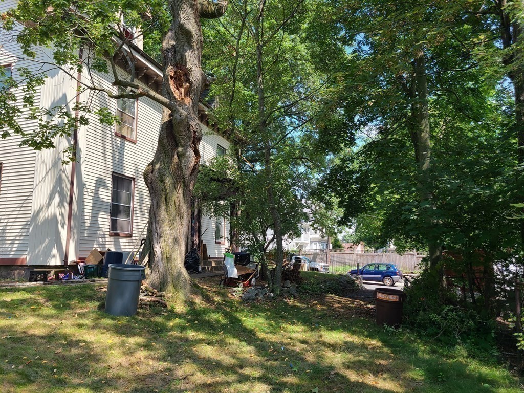 16 Malbert Road Boston, MA 02135 - Photo 34 of 38 a backyard of a house with lots of green space