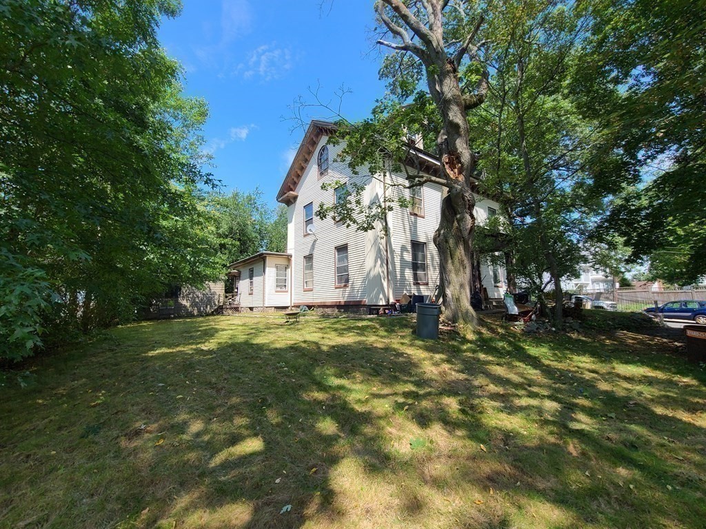 16 Malbert Road Boston, MA 02135 - Photo 4 of 38 a backyard of a house with a table and chairs