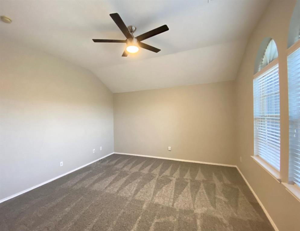 10608 Colfax Drive McKinney, TX 75072 - Photo 12 of 21 an empty room with a window and a fan