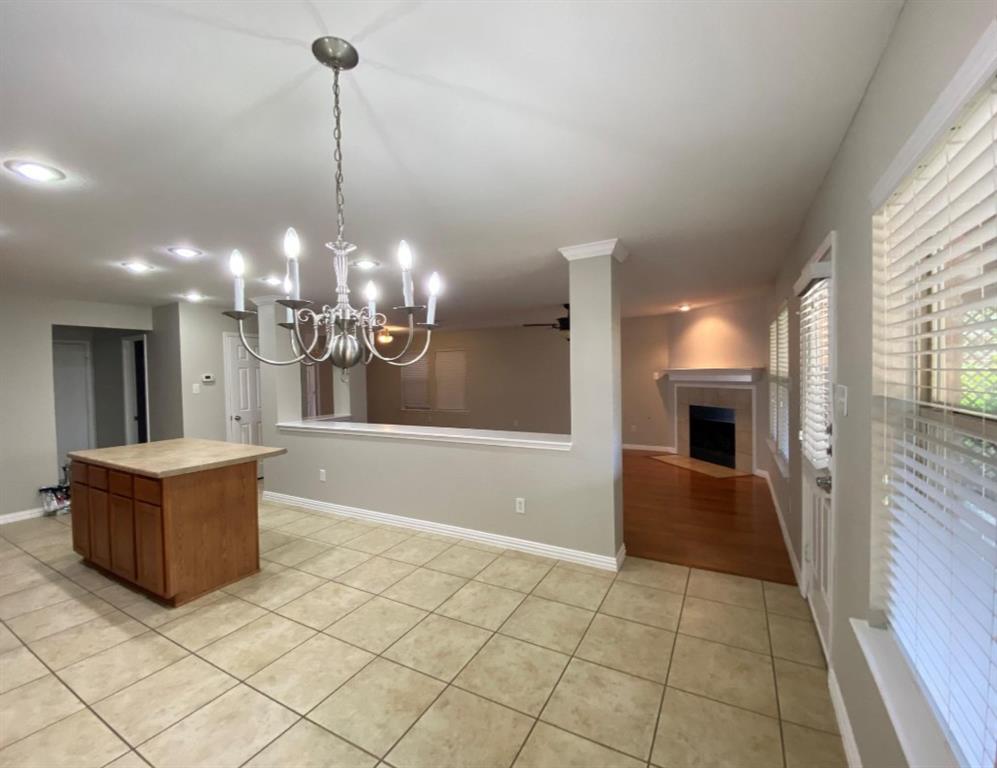 10608 Colfax Drive McKinney, TX 75072 - Photo 9 of 21 a view of a livingroom with a chandelier