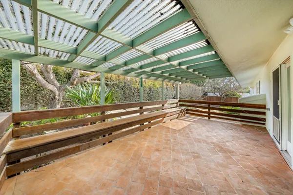 front view of a house with a yard and table and chairs