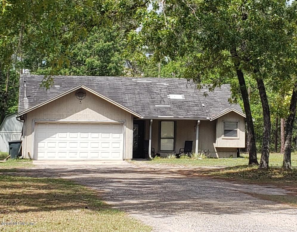 4206 Mustang Road Middleburg, FL 32068 - Photo 1 of 6 a front view of a house with a garden