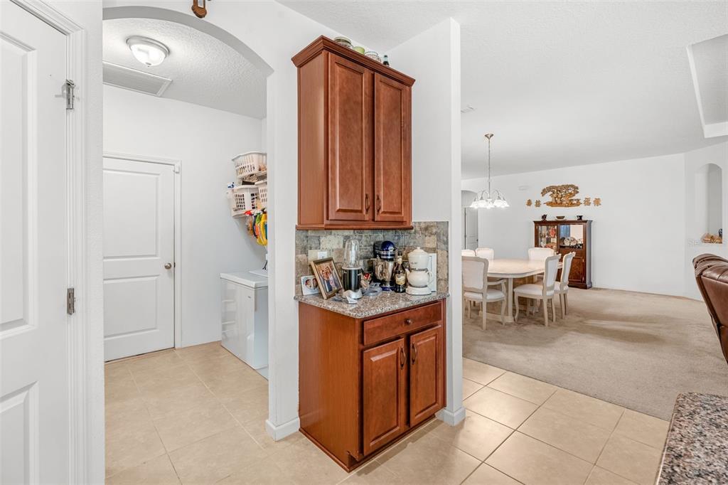 2085 Lula Road Minneola, FL 34715 - Photo 20 of 39 a kitchen with stainless steel appliances granite countertop a stove and a refrigerator
