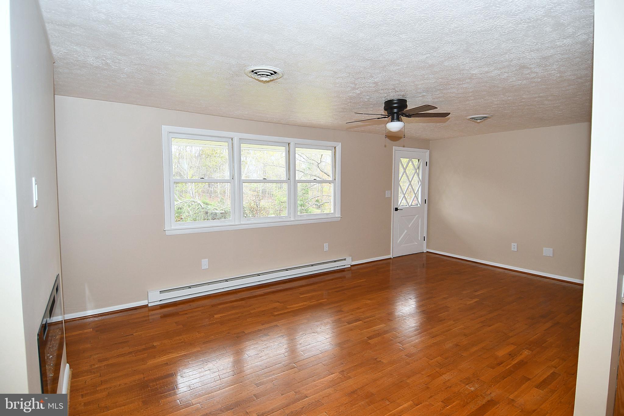 340 Highland Ridge Road Berkeley Springs, WV 25411 - Photo 8 of 44 Living Room with hardwood floors