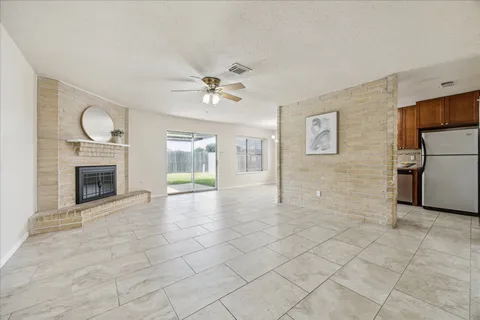 a view of an empty room with a fireplace