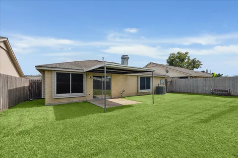 a house with yard in front of it