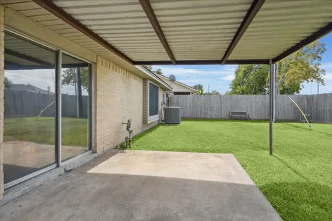 a view of a back yard of the house