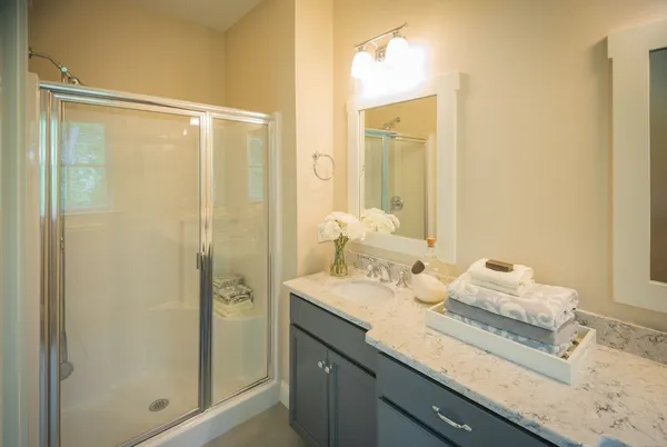 a bathroom with a granite countertop sink mirror and double