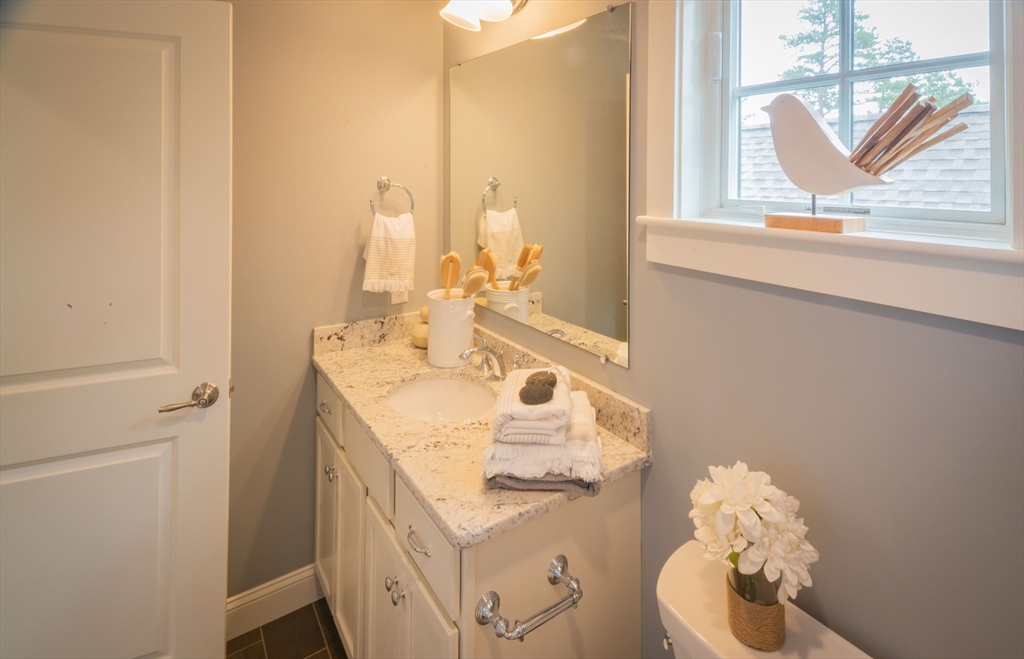 12 Wisteria Road Plymouth, MA 02360 - Photo 15 of 22 a bathroom with a sink and a mirror