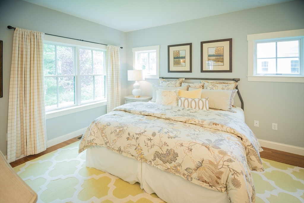 12 Wisteria Road Plymouth, MA 02360 - Photo 9 of 22 a large bed sitting in a bedroom next to a window