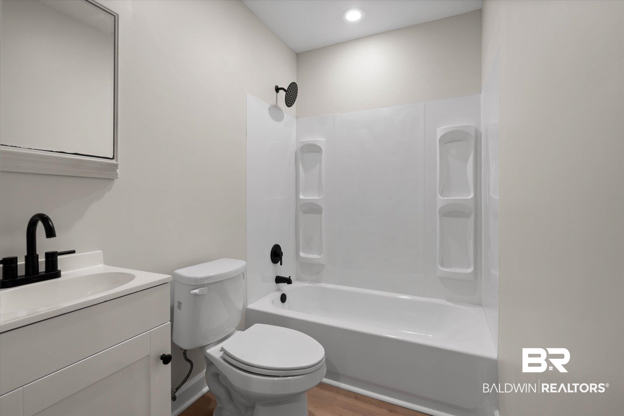 3715 Latigo Road Mobile, AL 36695 - Photo 23 of 39 Full bathroom with vanity, wood finished floors, toilet, and tub / shower combination