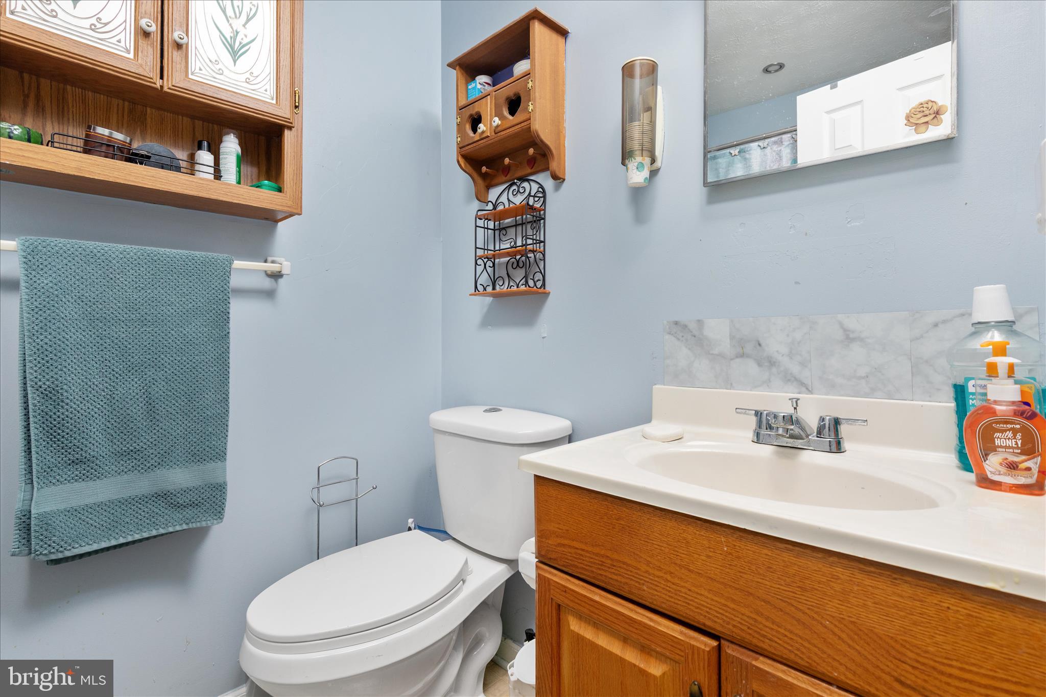 132 Stadium Circle Inwood, WV 25428 - Photo 19 of 25 a bathroom with a sink a toilet and shower