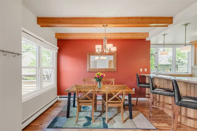 a view of a bathroom with a sink and a wooden floor
