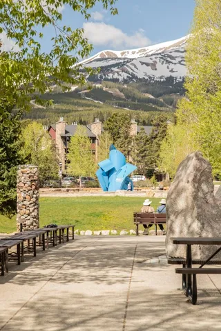 a front view of a residential apartment building with a yard