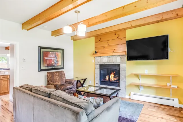 a living room with a couch and a fireplace