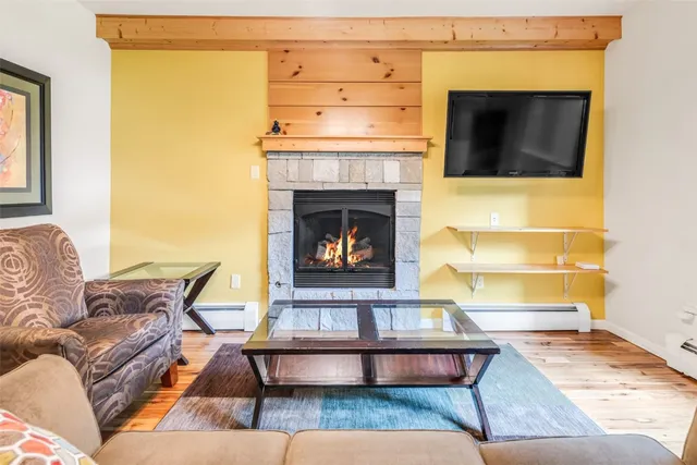 a open kitchen with a table chairs a sink dishwasher window and cabinets