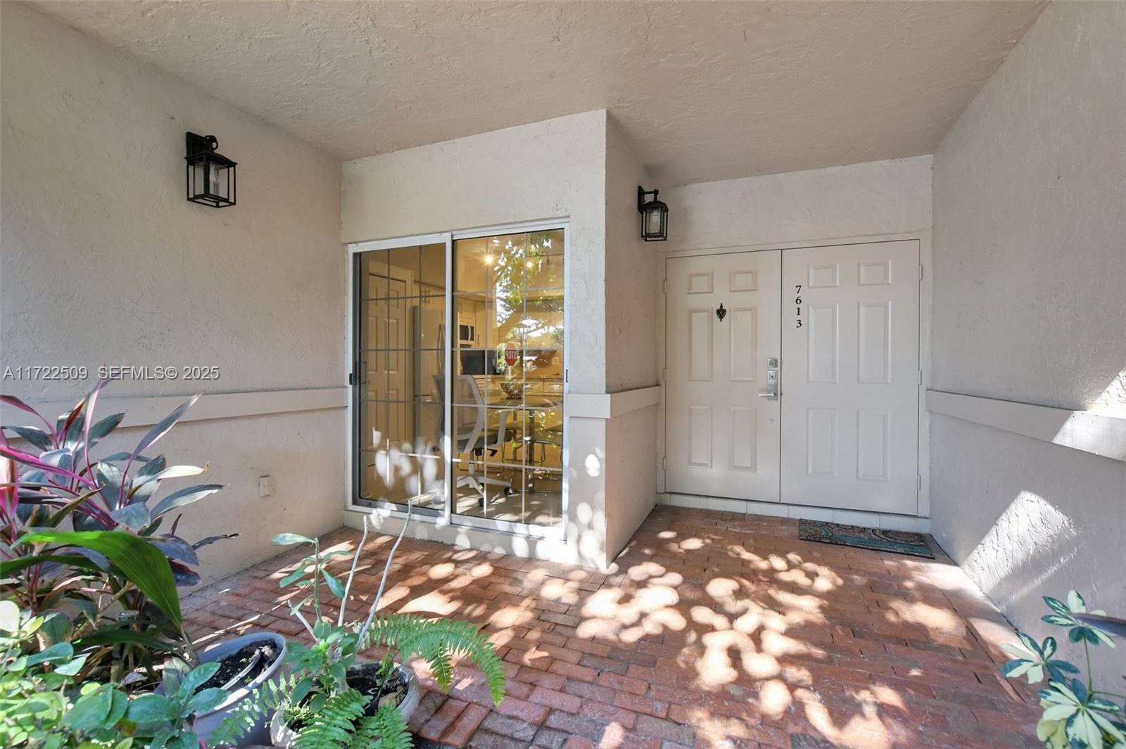 a view of a door and wooden floor