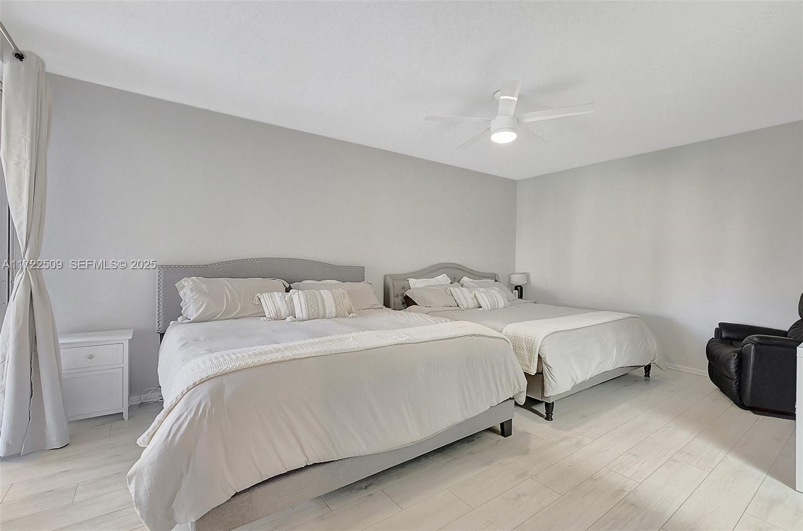 Boca Pointe Boca Raton, FL 33433 - Photo 16 of 32 a spacious bedroom with a bed and a table