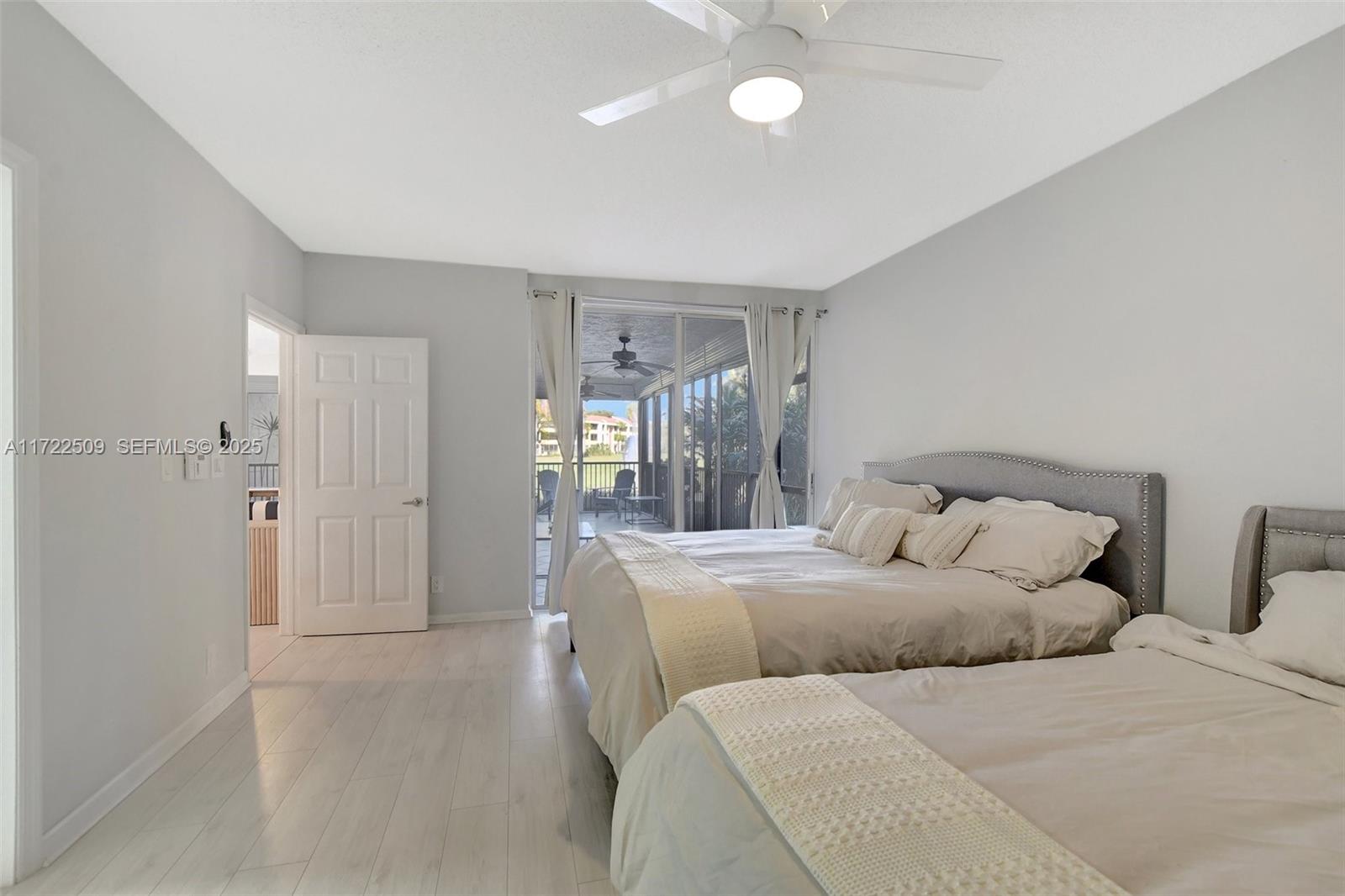 Boca Pointe Boca Raton, FL 33433 - Photo 17 of 32 a bedroom with a bed and a chandelier