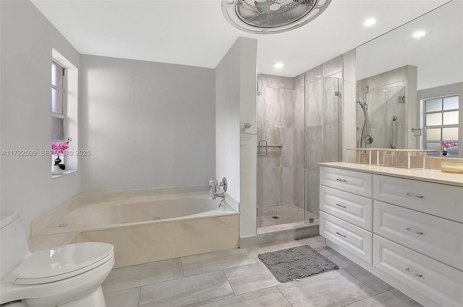 Boca Pointe Boca Raton, FL 33433 - Photo 20 of 32 a spacious bathroom with a bathtub shower sink mirror and toilet