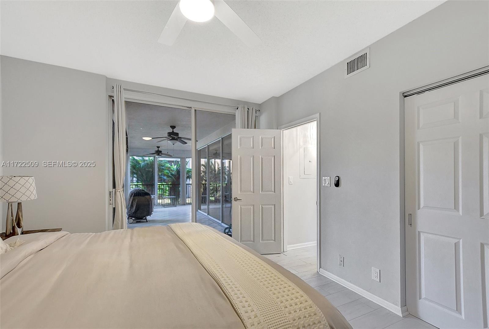 Boca Pointe Boca Raton, FL 33433 - Photo 23 of 32 a bedroom with a bed and a chandelier