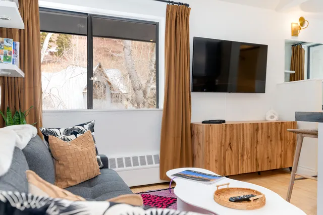 a living room with a couch and a flat screen tv
