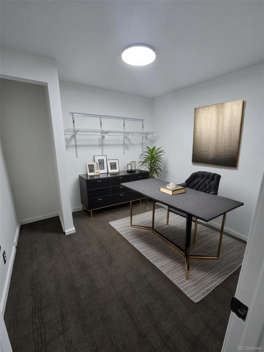 3310 Gilpin Street Denver, CO 80205 - Photo 18 of 20 a living room with furniture and a lamp