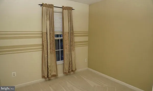 a white toilet sitting next to a bath tub