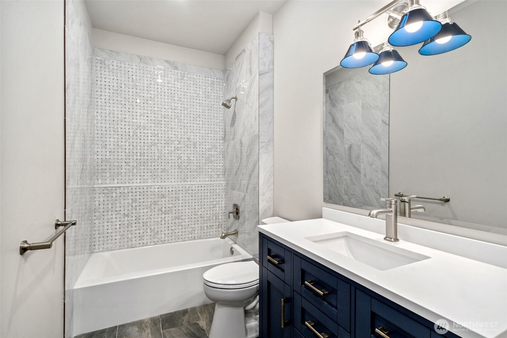 71 Heron Way, Unit A Sequim, WA 98382 - Photo 14 of 31 a bathroom with a sink a toilet a mirror a bathtub and shower