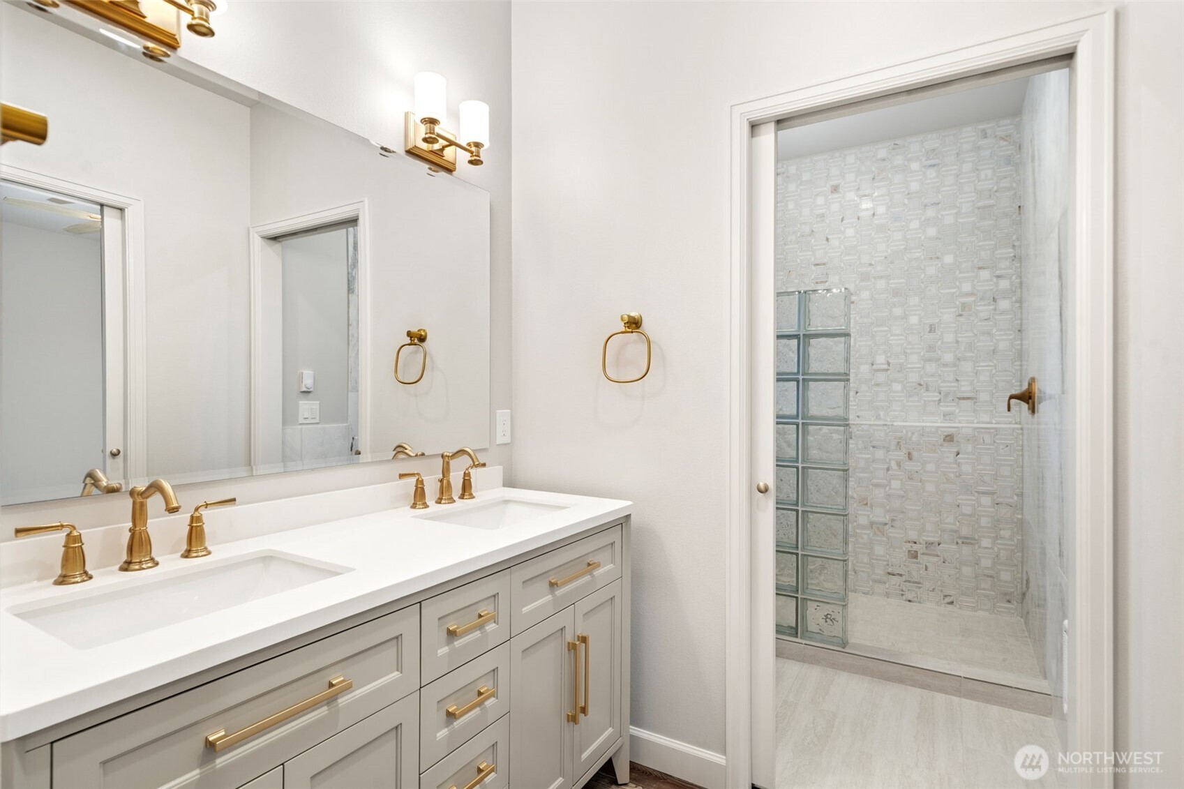 71 Heron Way, Unit A Sequim, WA 98382 - Photo 19 of 31 a bathroom with a shower sink and mirror