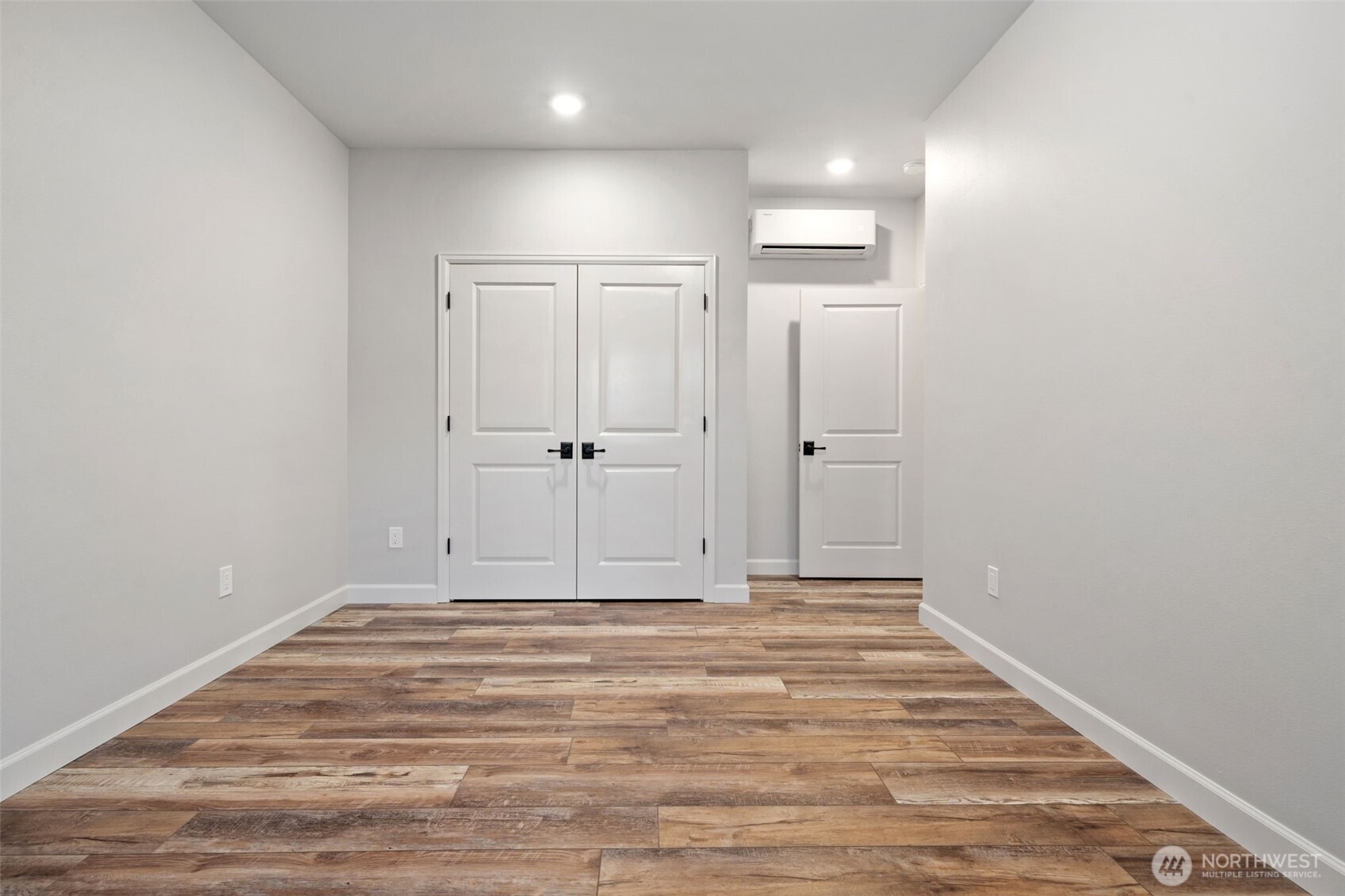 71 Heron Way, Unit A Sequim, WA 98382 - Photo 25 of 31 a view of room with wooden floor