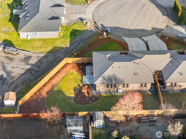 an aerial view of residential houses with outdoor space