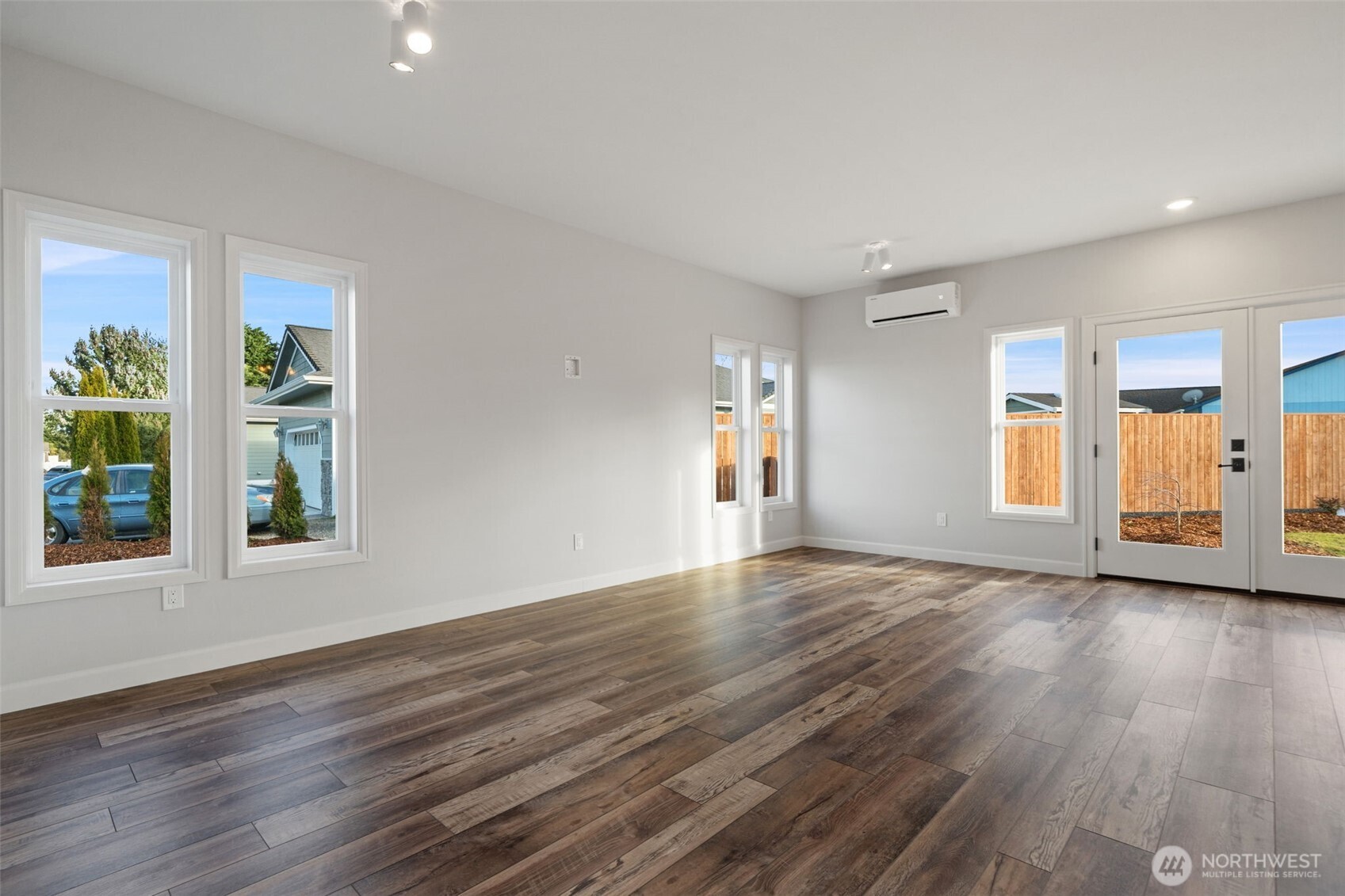 71 Heron Way, Unit A Sequim, WA 98382 - Photo 4 of 31 a view of an empty room with window and wooden floor